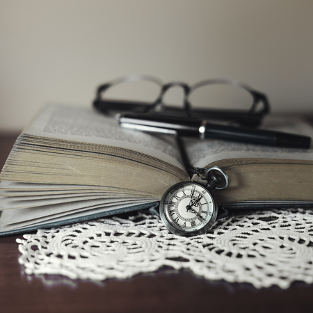 Vintage pocket watch on the tableの写真素材