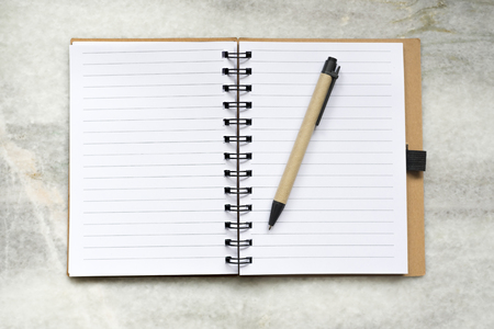 Notebook  lie on a marble background, from aboveの写真素材