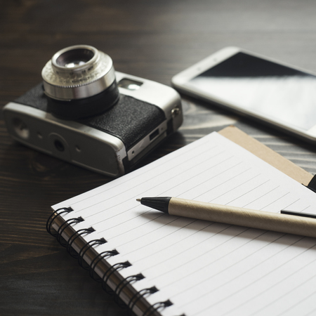 Retro camera and various personal items. Close up