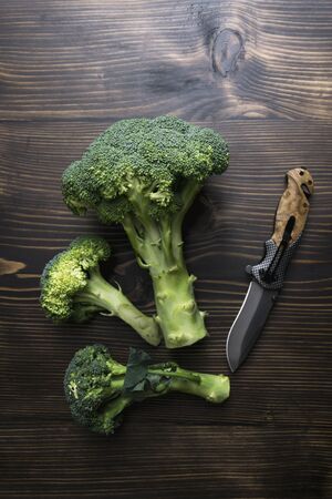 Broccoli on a wooden table, rustic styleの写真素材