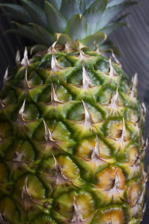 Close up photo of ripe pineapple on a  wooden tableの写真素材