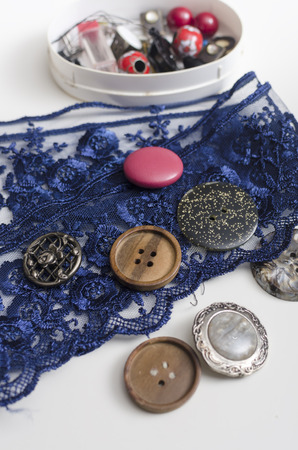 Tools and accessories for sewing on light wooden background.の写真素材