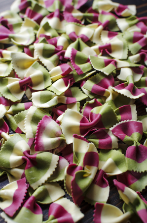 Italian raw multicolored farfalle pasta.Close upの写真素材