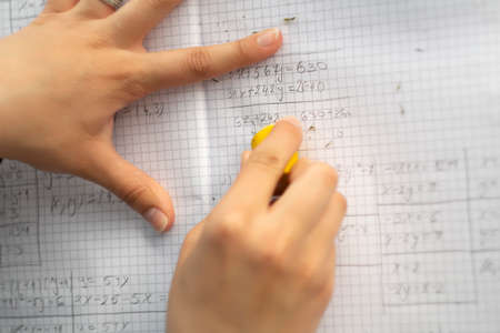 student using eraser for edit mistake, from aboveの写真素材