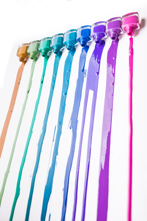 rainbow of nail polish isolated on a white backgroundの写真素材