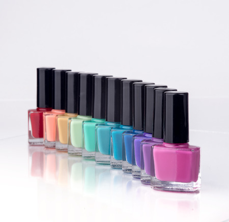 rainbow of nail polish isolated on a white backgroundの写真素材