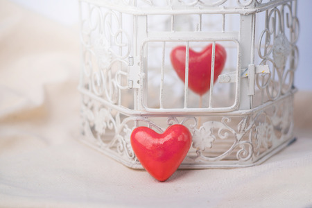 red heart locked in a vintage cageの写真素材