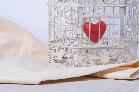 red heart locked in a vintage cageの写真素材