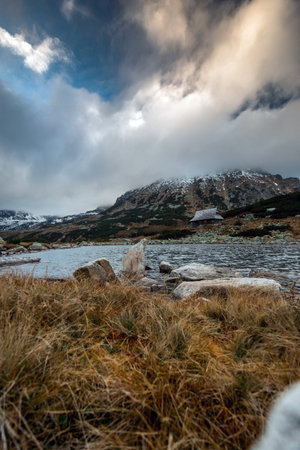 Beautiful mountain landscape with dramatic cloudy skyの写真素材