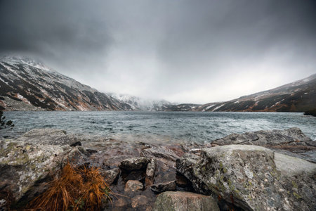 Beautiful mountain landscape with dramatic cloudy skyの写真素材