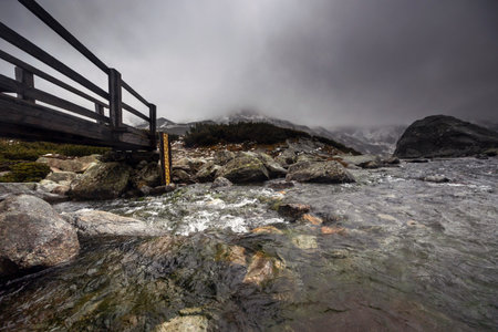 Beautiful mountain landscape with dramatic cloudy skyの写真素材