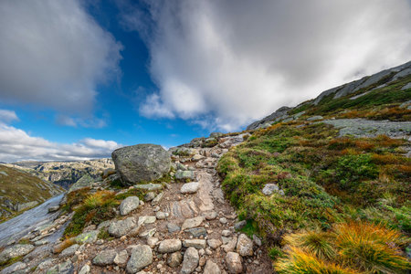 Beautiful mountain landscape with dramatic cloudy skyの写真素材