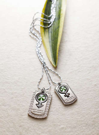 Products made of artificial amber, lucky clover jewelryの写真素材