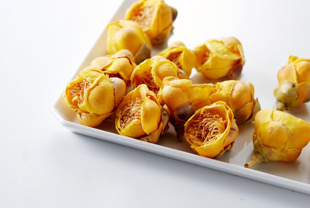 Closeup dried camellia flowers on white background
