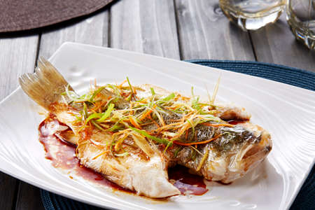 Chinese food, Steamed Fish on wooden tableの写真素材