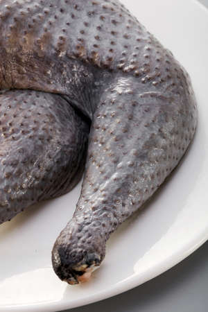 Fresh ingredients, closeup fresh black chicken legの写真素材