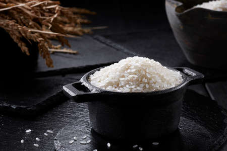 Closeup of  raw rice in potの写真素材