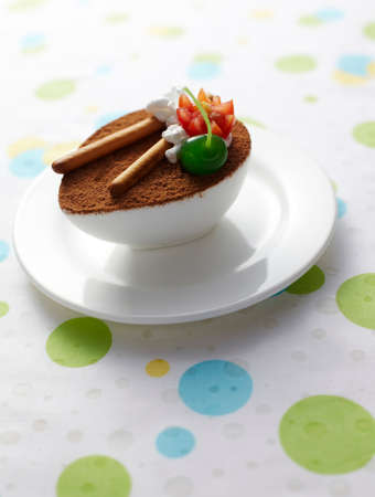 Tiramisu cake on color background