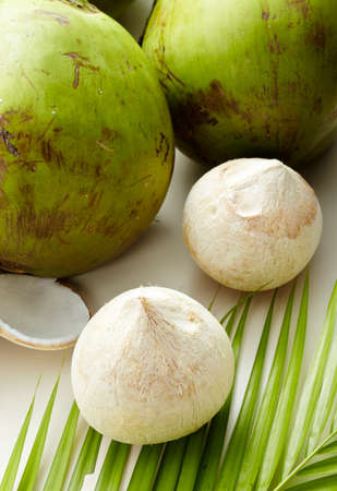 Green coconut on white Leaves  background