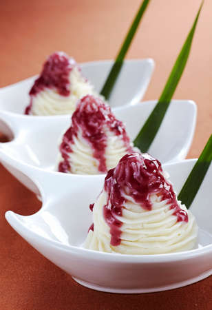 Creamy dumplings with berry sauce. Selective focus