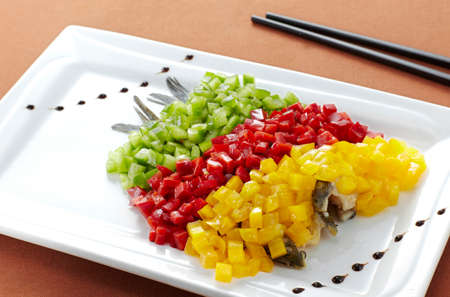 Slices of fresh vegetables on white plate.の写真素材