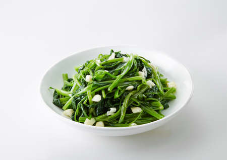 A bowl of seaweed salad on white backgroundの写真素材