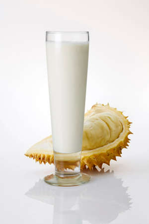 Fresh milk in a glass and durian on a white background.の写真素材