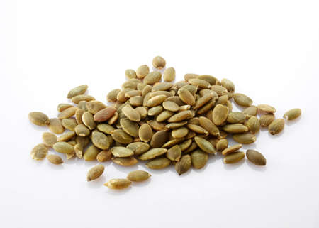 pumpkin seeds isolated on white background. healthy food ingredient.