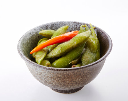Boiled edamame in bowl isolated on the white background.の写真素材