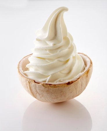Vanilla ice cream in a wooden bowl on a white background.の写真素材