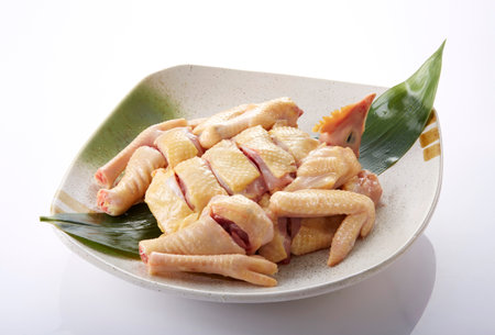Raw chicken wing on white background,Thai food and cuisine.の写真素材