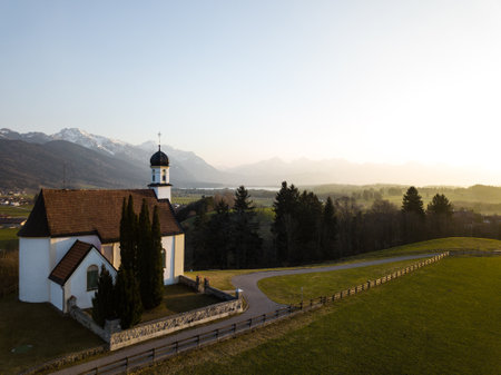 Little chapel on a hill near the alps