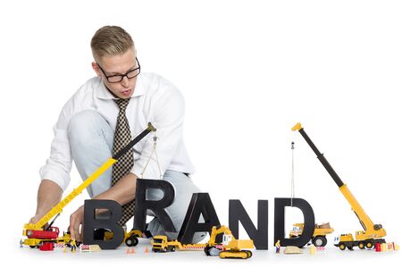 Brand start up: Businessman building brand-word.の写真素材