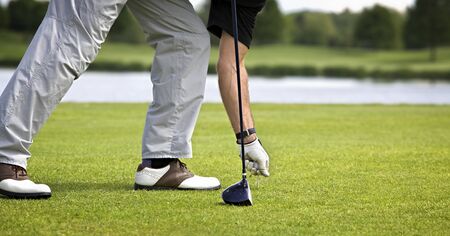 Golfer preparing for teeing off.の写真素材