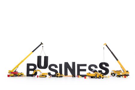 Build up a business: Machines building word.の写真素材