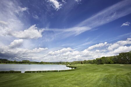 Golf course fairway and fantastic skyの写真素材