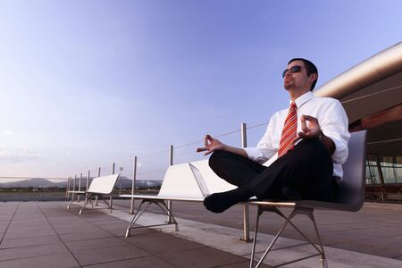 Businessman meditating.の写真素材