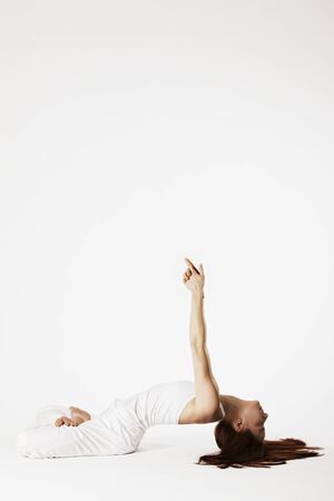 Woman in fish Yoga posture (Matsyasana)の写真素材