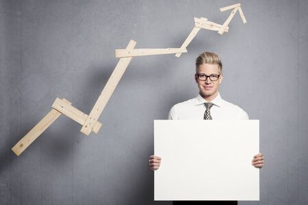 Confident businessman with white empty panel.の写真素材