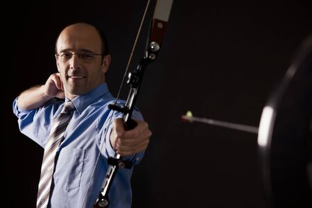Business person hit target with arrow.の写真素材