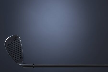 Golf club isolated on dark blue background.