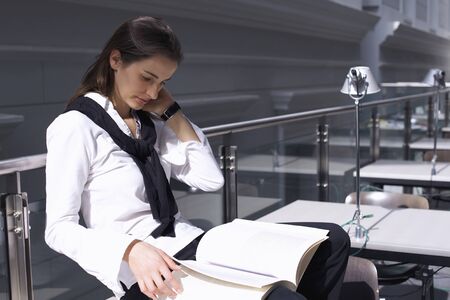 Student sitting and readingの写真素材