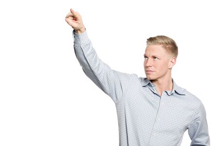Portrait of young businessman drawing with finger in the air, blank space for text or symbol, isolated on white background.の写真素材