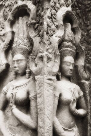 Female divinities (Apsaras) at Angkor temple, Angkor, Cambodia, infrared-monochrome image.