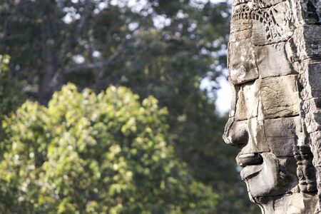 Profile of carved face on one of the 54 towers at Bayon temple, Angkor, Cambodiaの写真素材