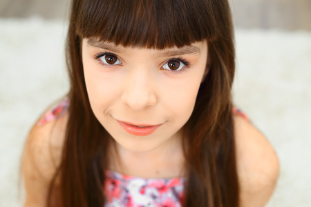 Portrait of beautiful happy little girl brown eyes