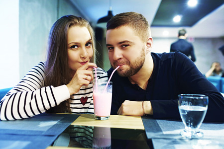 Two people in cafe enjoying the time spending with each other. Toned. Selective focus.の写真素材
