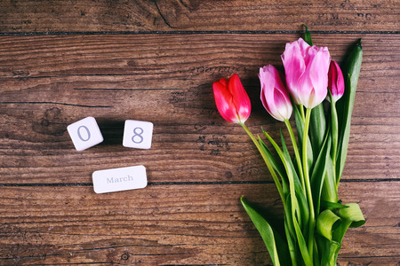 Pink Tulip Flowers and the date block calendar on rustic table for March 8, International Womens Day, Birthday, Valentines Day or Mothers day - Top Viewの写真素材