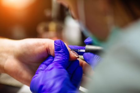 Nail care in salon. Selective focus on costumers nails. Selective focus.の写真素材