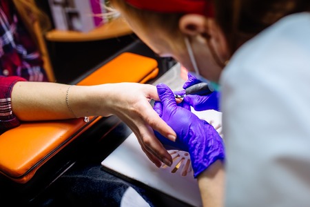 Nail care in salon. Selective focus on costumers nails. Selective focus.の写真素材